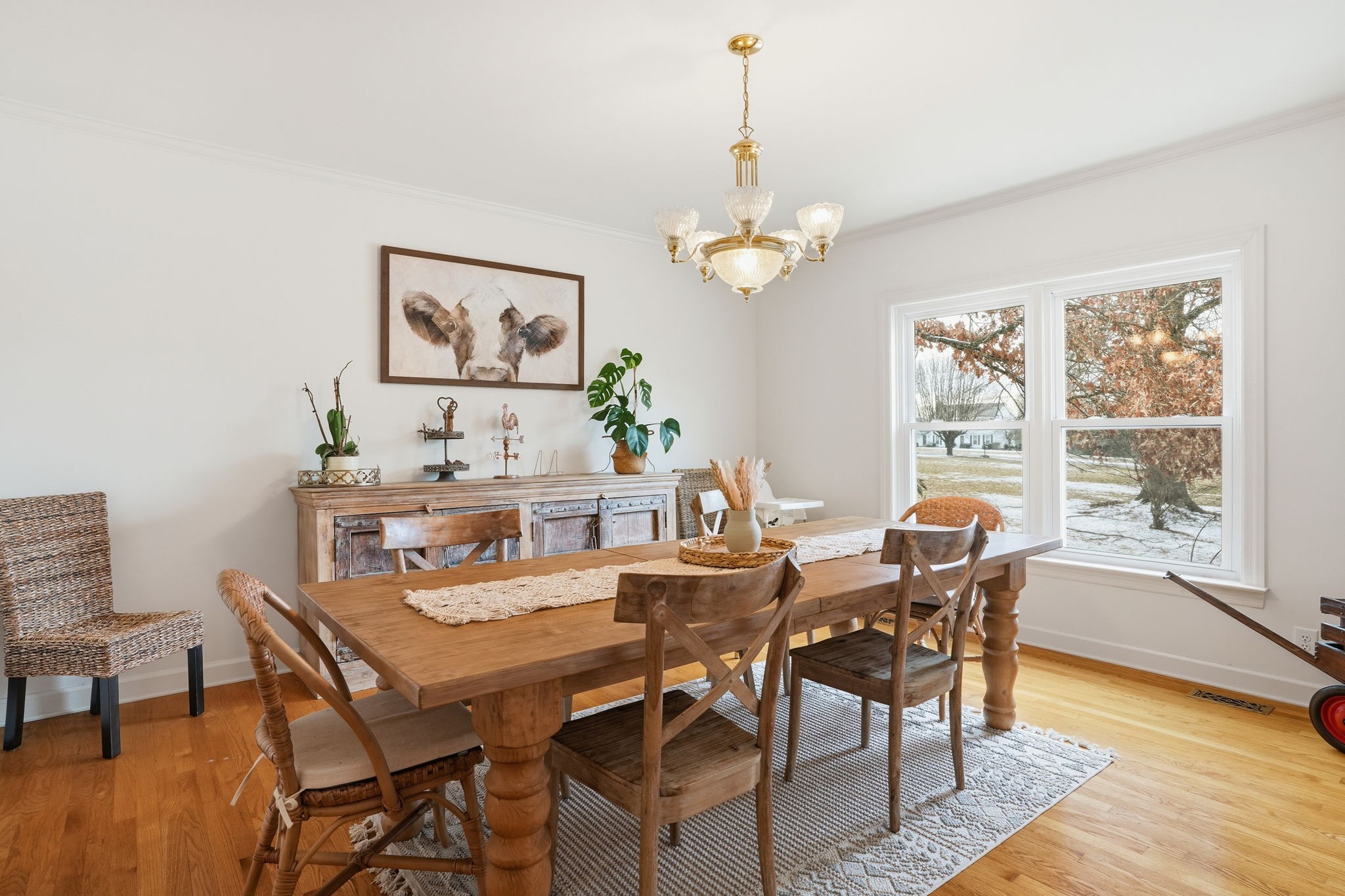 218 Spring Valley Road Hendersonville, TN 37075 - Photo 9 of 60 a view of a dining room with furniture a chandelier and wooden floor