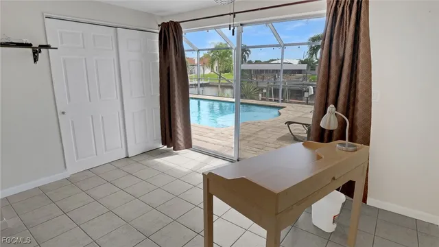 a view of a dining room with furniture and chandelier
