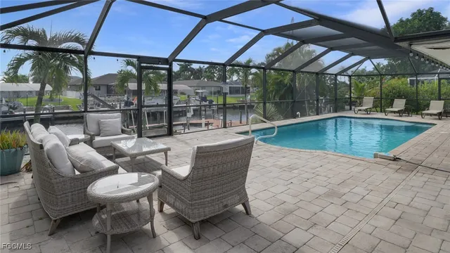 a view of a swimming pool with a patio