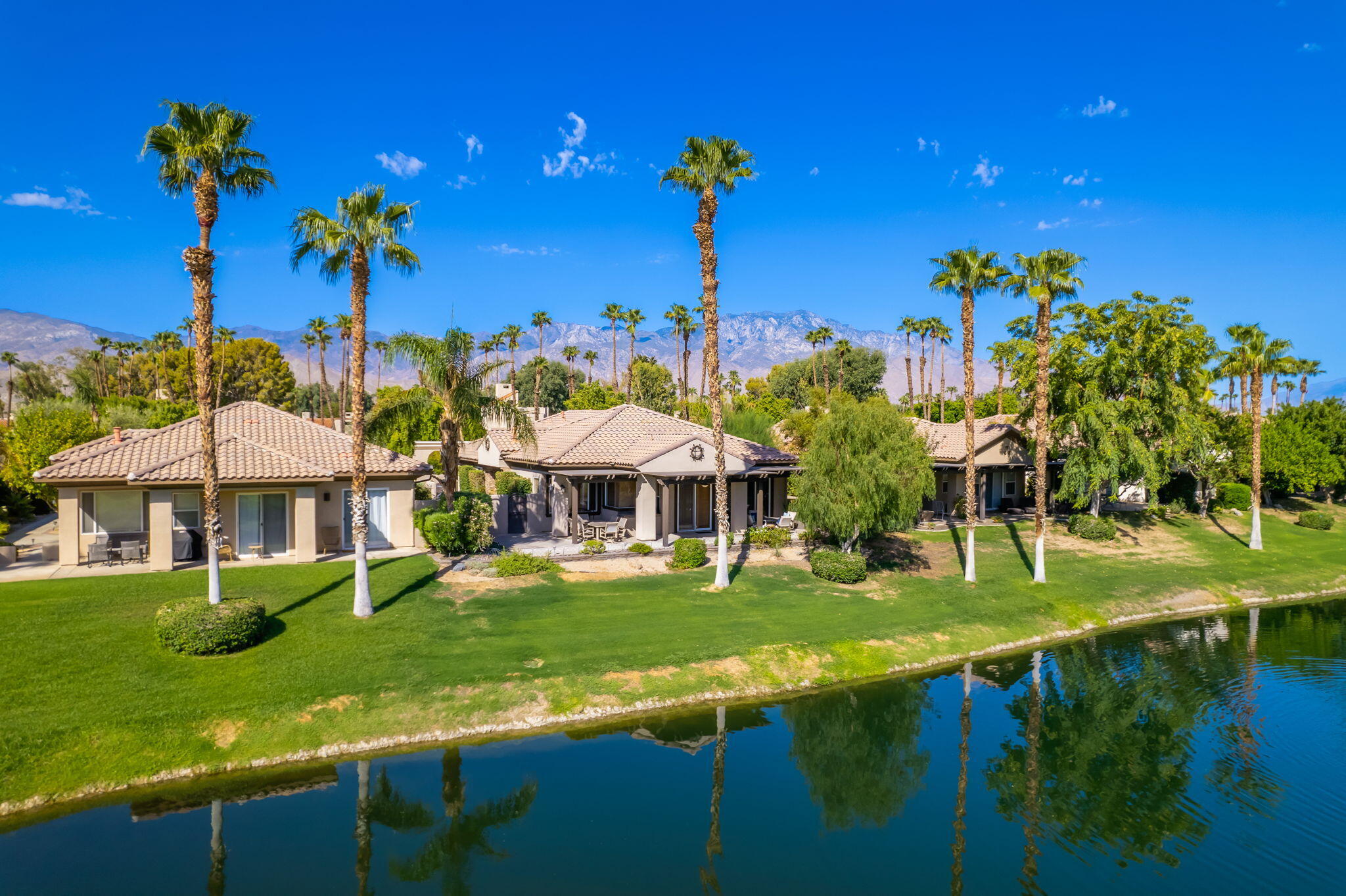 a view of a house with pool and yard