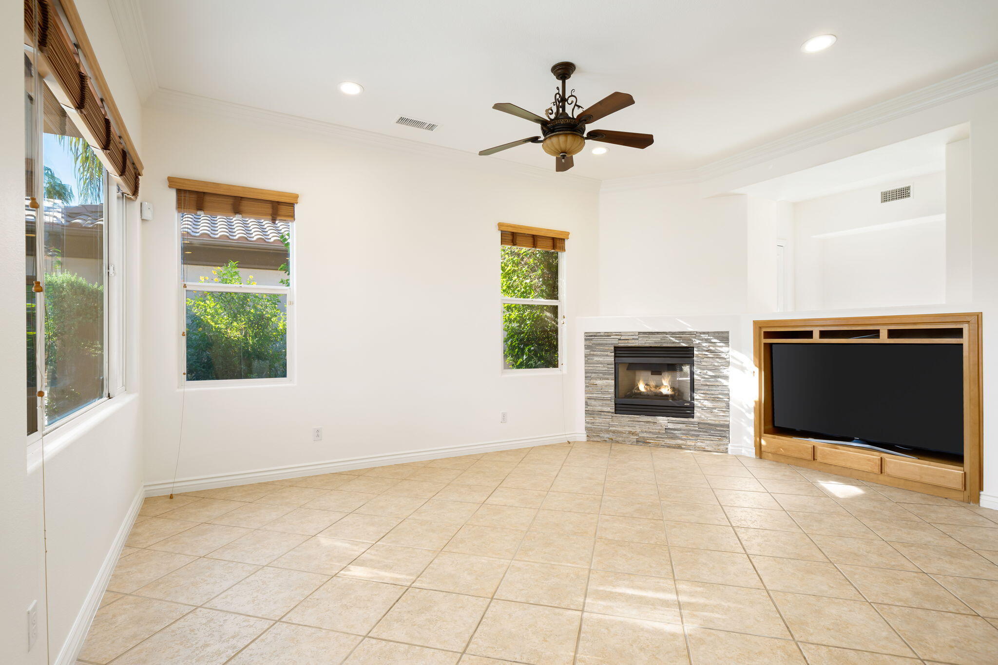27 Racquet Club Drive South Rancho Mirage, CA 92270 - Photo 13 of 44 a view of a livingroom with a fireplace and window