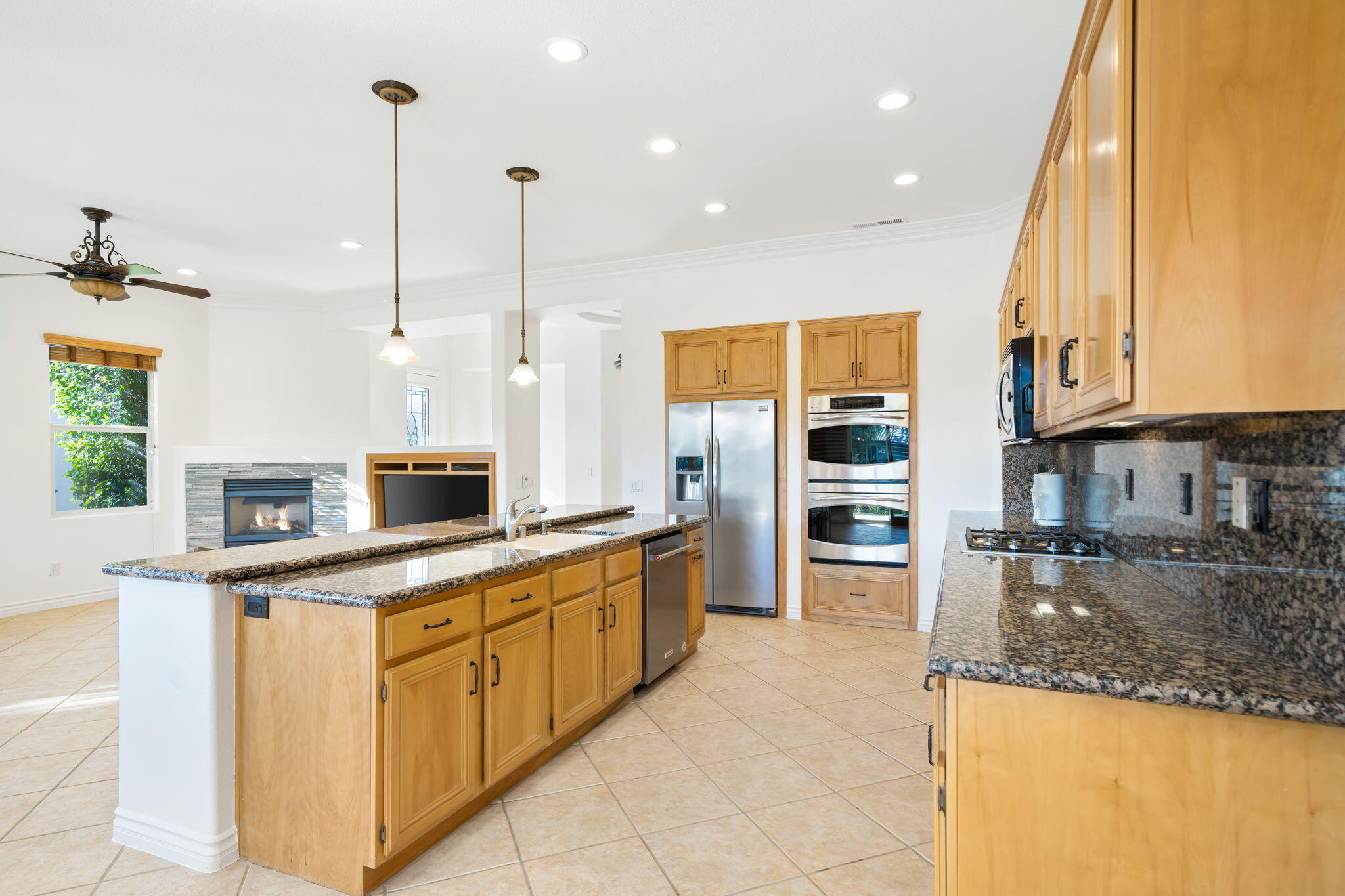 27 Racquet Club Drive South Rancho Mirage, CA 92270 - Photo 17 of 44 a large kitchen with stainless steel appliances granite countertop a stove and a sink