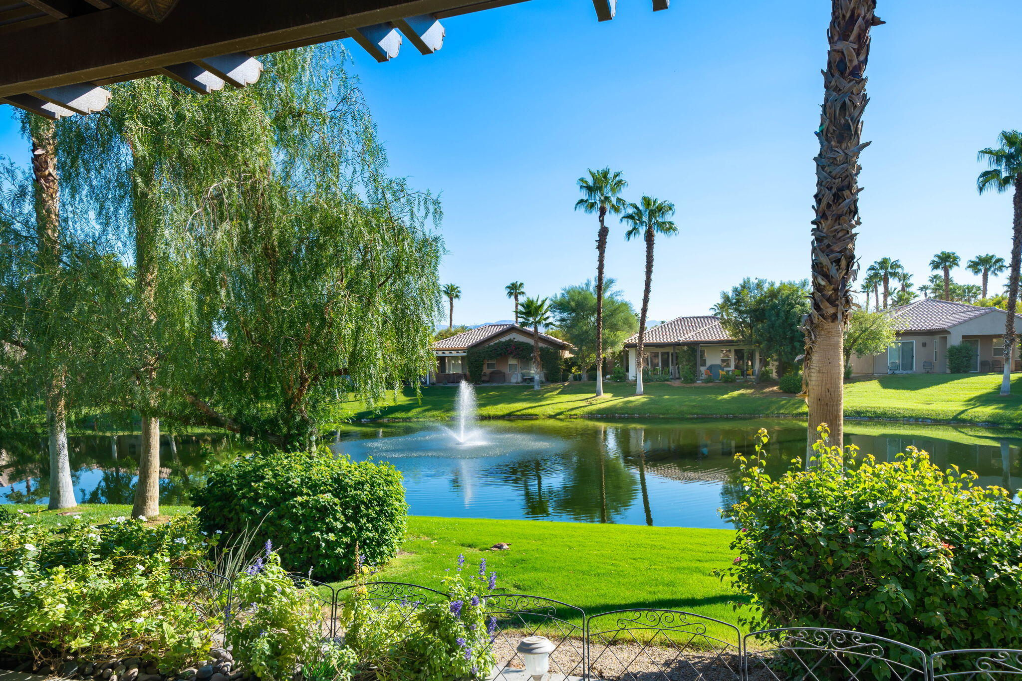 27 Racquet Club Drive South Rancho Mirage, CA 92270 - Photo 24 of 44 a view of a garden with a fountain