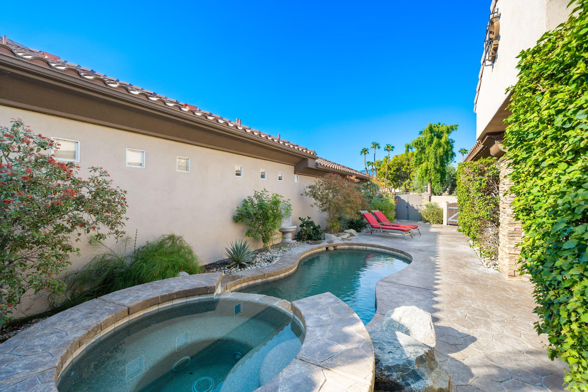 27 Racquet Club Drive South Rancho Mirage, CA 92270 - Photo 29 of 44 a view of a swimming pool with a patio