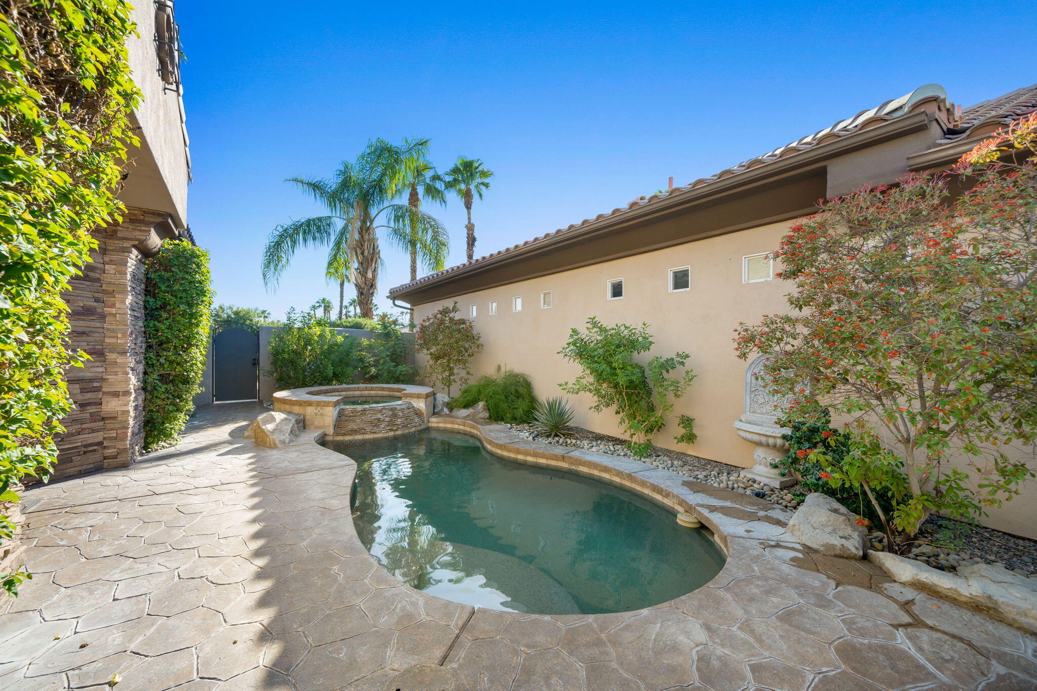 27 Racquet Club Drive South Rancho Mirage, CA 92270 - Photo 30 of 44 a view of swimming pool with a patio
