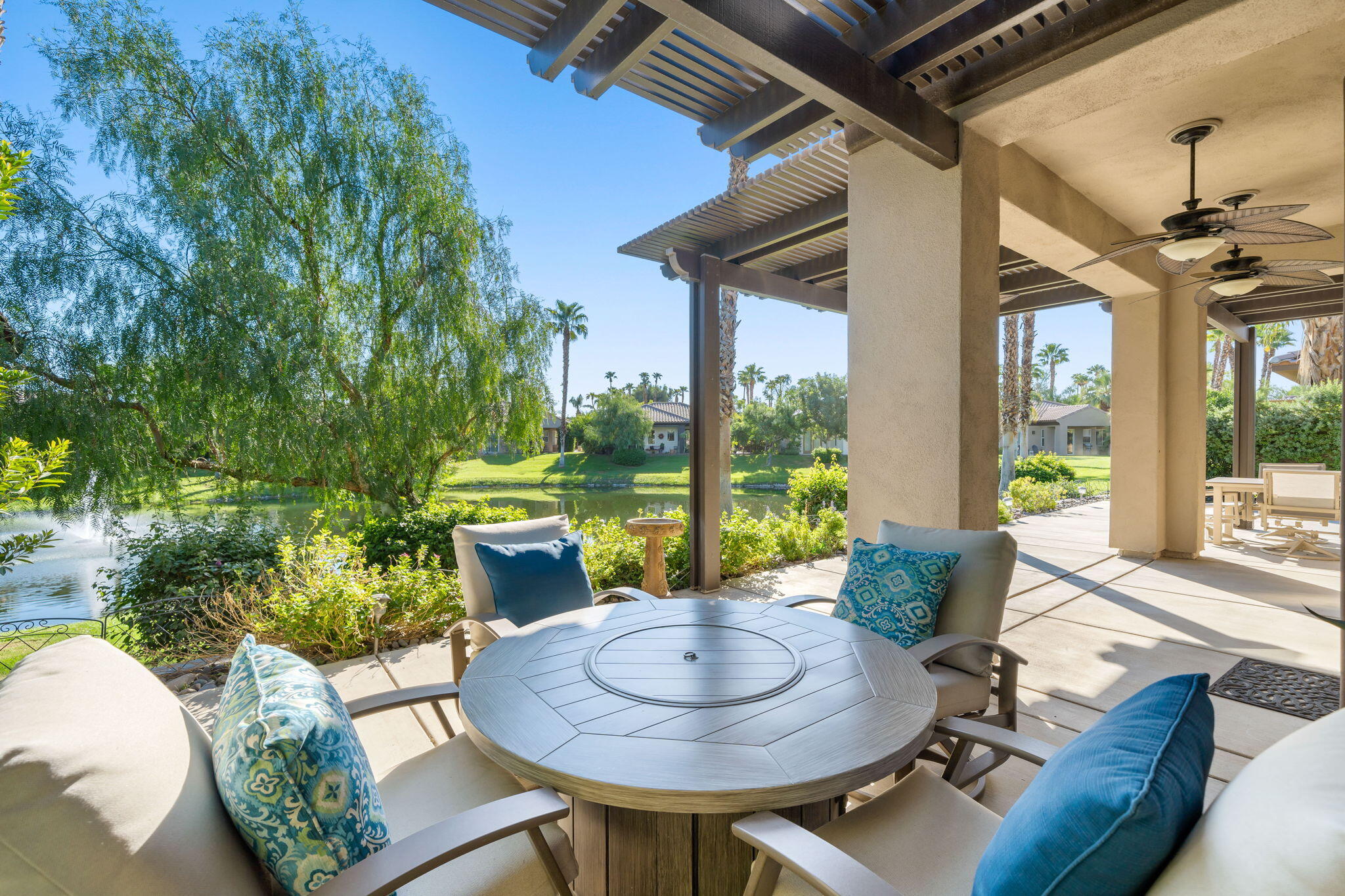 27 Racquet Club Drive South Rancho Mirage, CA 92270 - Photo 3 of 44 a living room with furniture and a floor to ceiling window