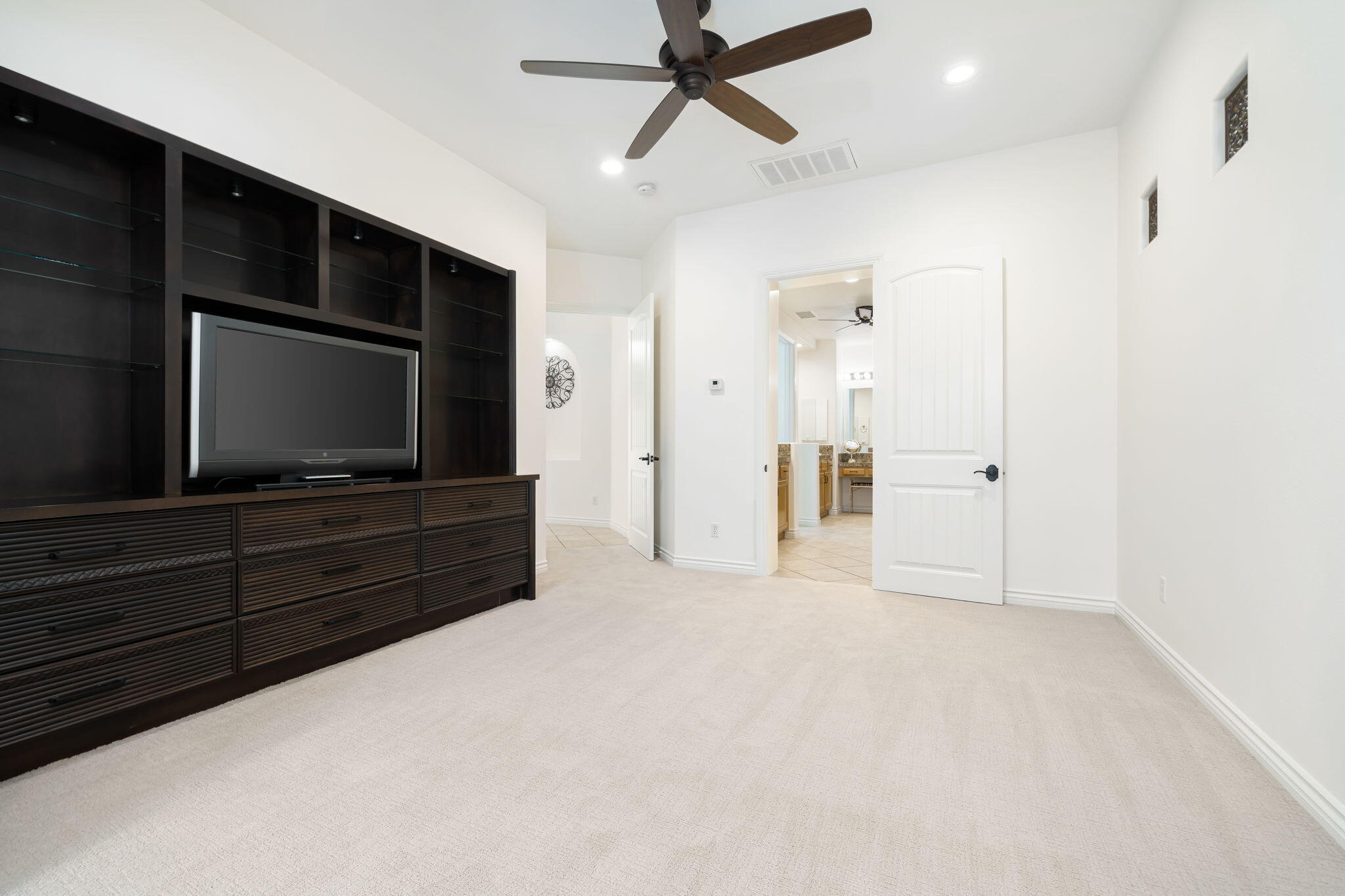 27 Racquet Club Drive South Rancho Mirage, CA 92270 - Photo 34 of 44 a living room with furniture and a flat screen tv