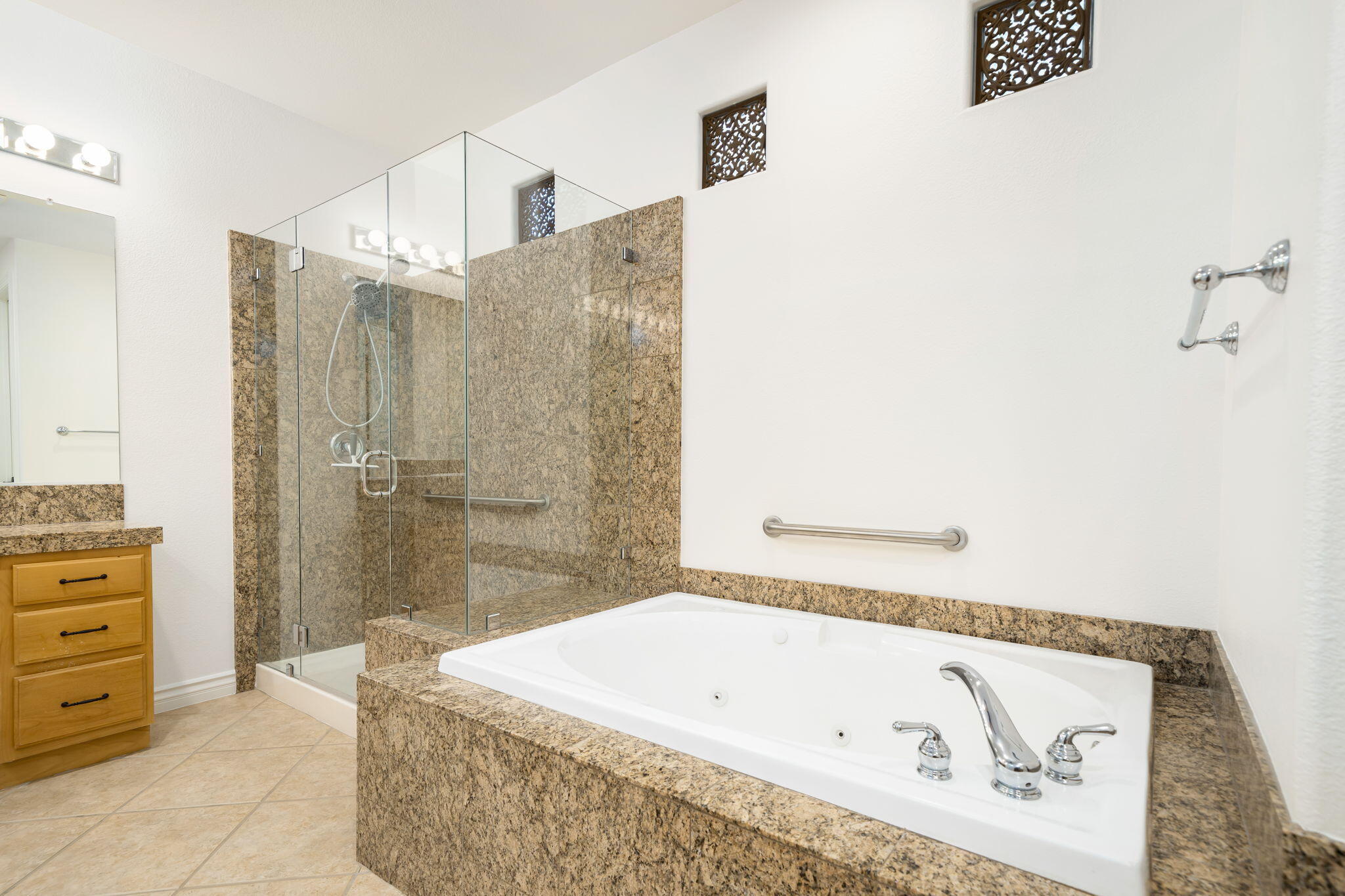 27 Racquet Club Drive South Rancho Mirage, CA 92270 - Photo 36 of 44 a bathroom with a tub a sink and a shower