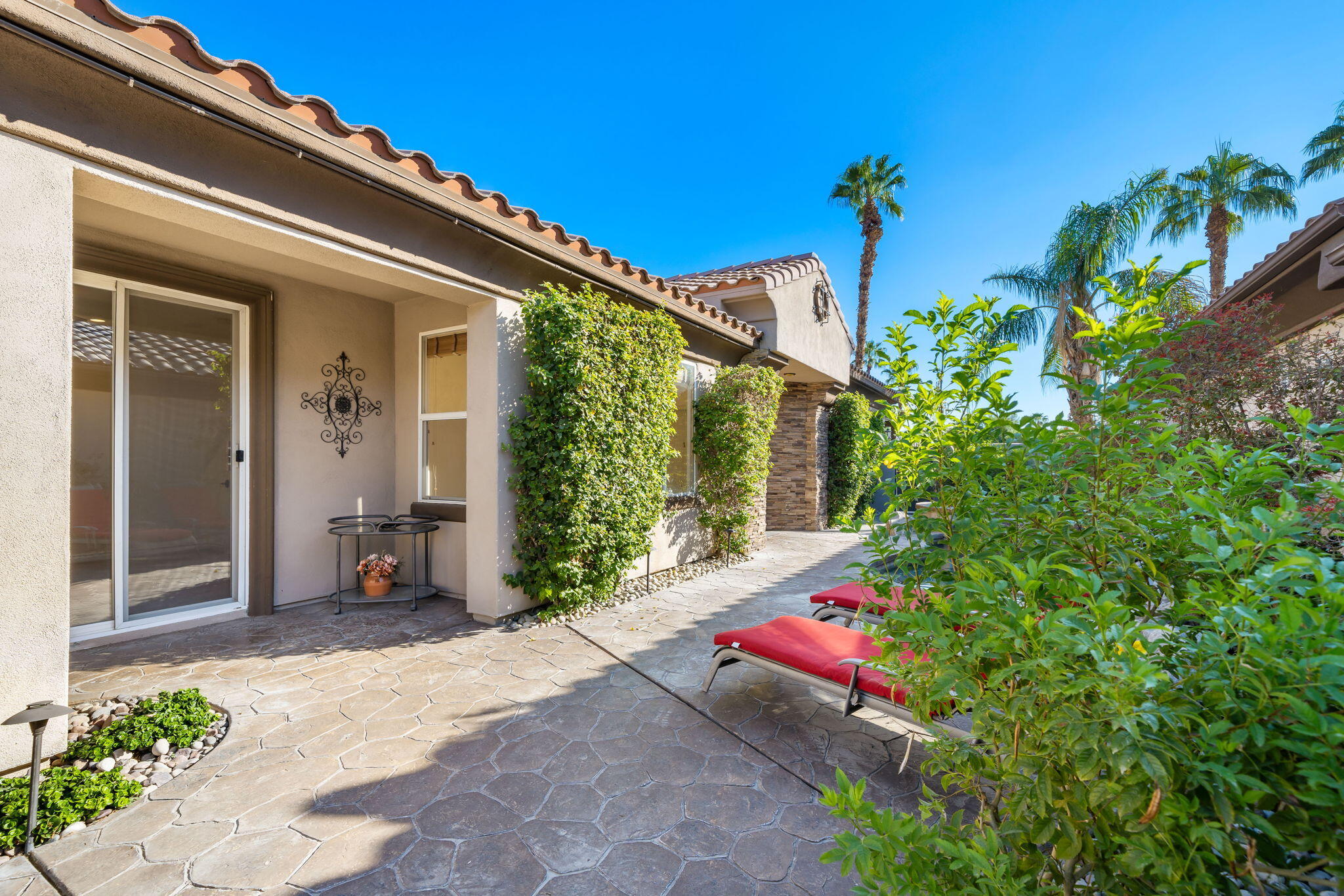 27 Racquet Club Drive South Rancho Mirage, CA 92270 - Photo 39 of 44 front view of a house with a yard