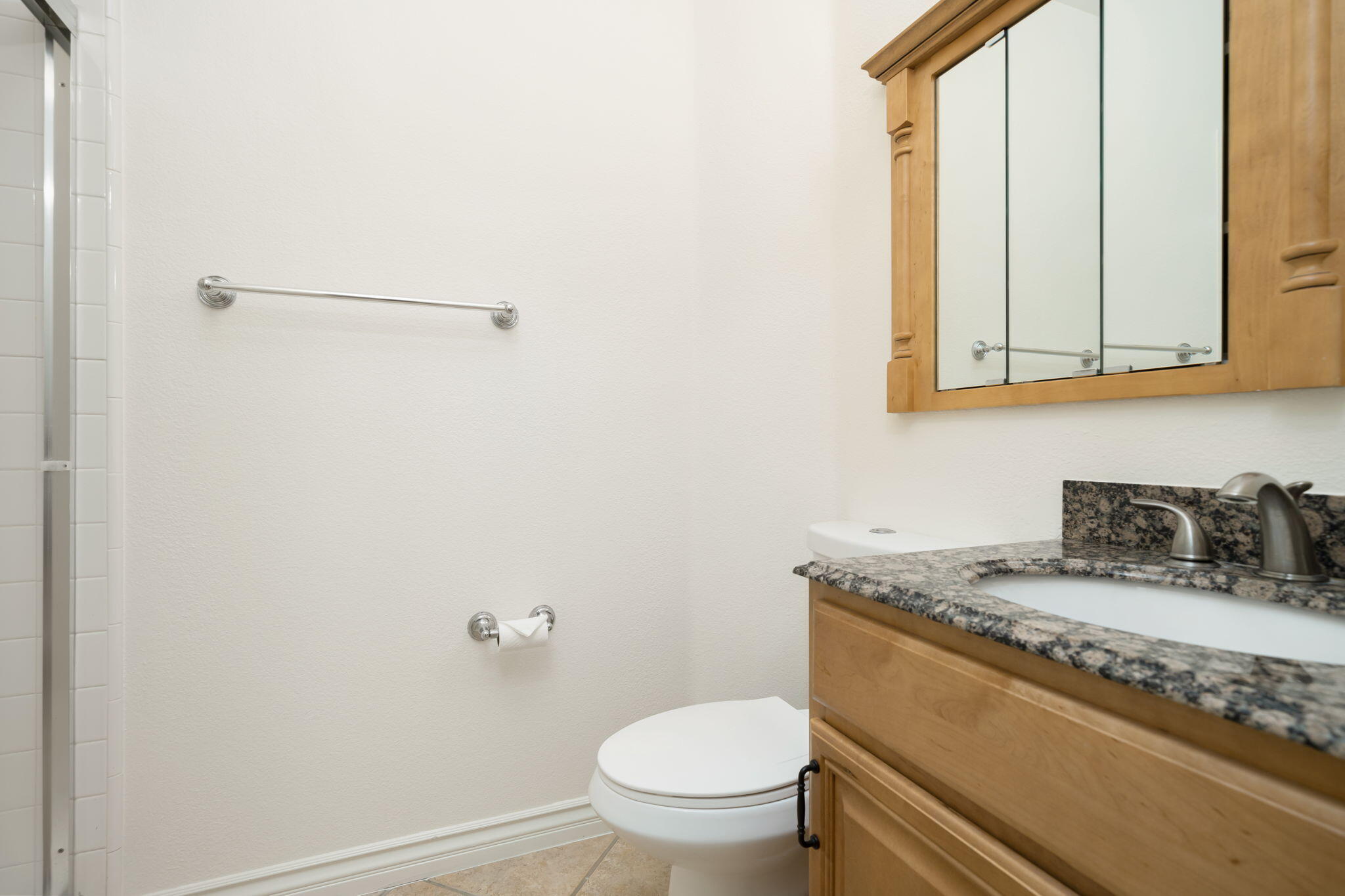 27 Racquet Club Drive South Rancho Mirage, CA 92270 - Photo 42 of 44 a bathroom with a granite countertop sink and a toilet
