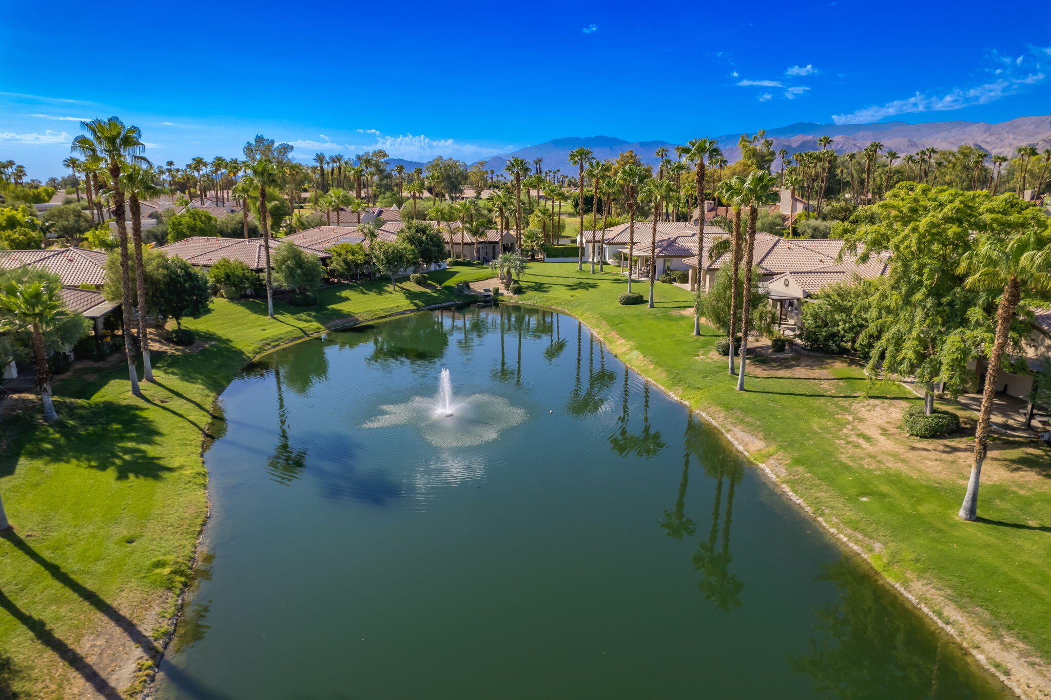 27 Racquet Club Drive South Rancho Mirage, CA 92270 - Photo 44 of 44 a view of a lake with houses
