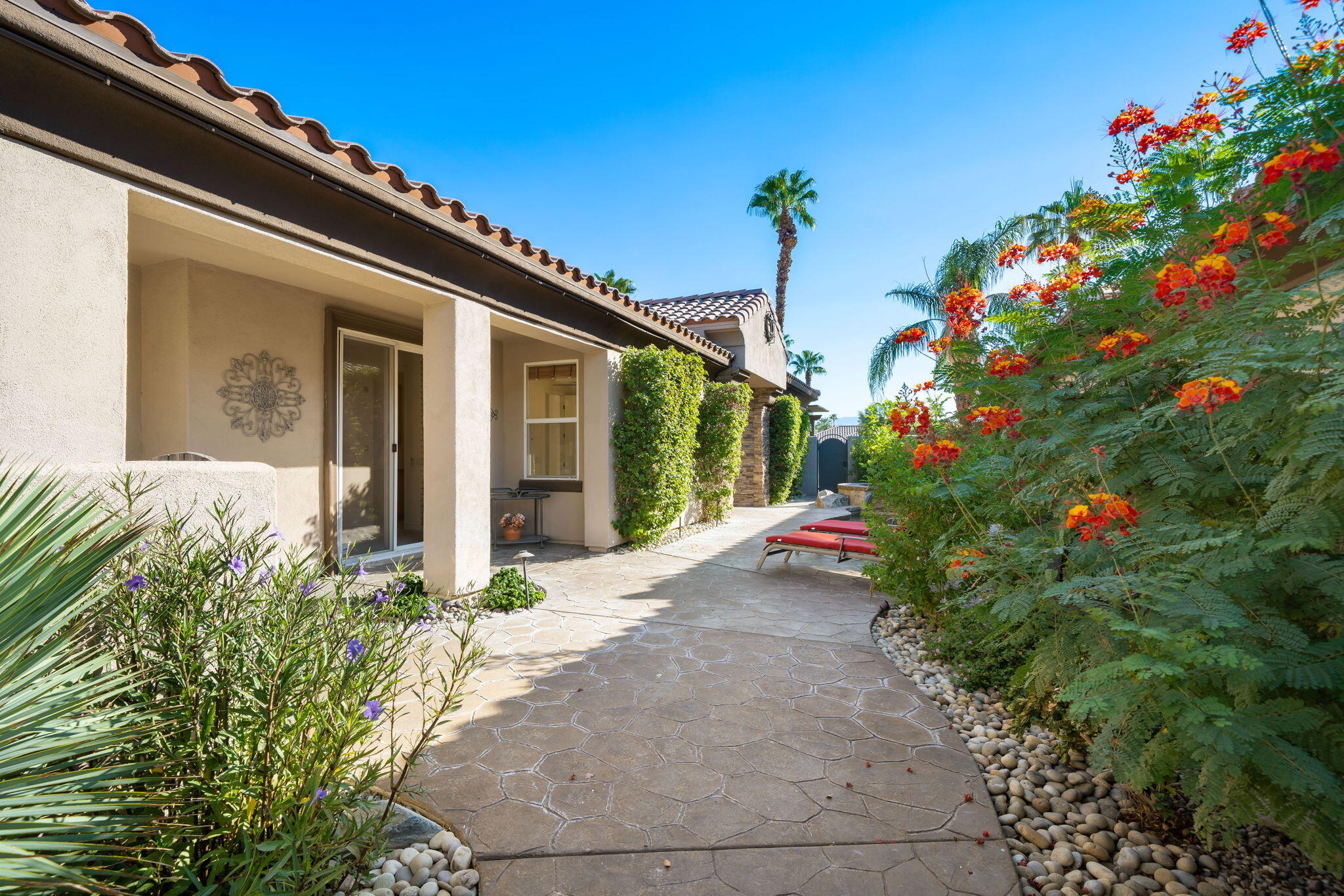 27 Racquet Club Drive South Rancho Mirage, CA 92270 - Photo 8 of 44 a view of a house with flower plants