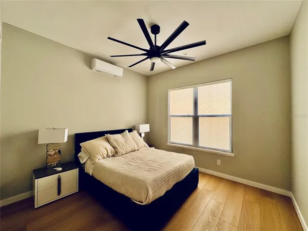 a bedroom with a bed and window