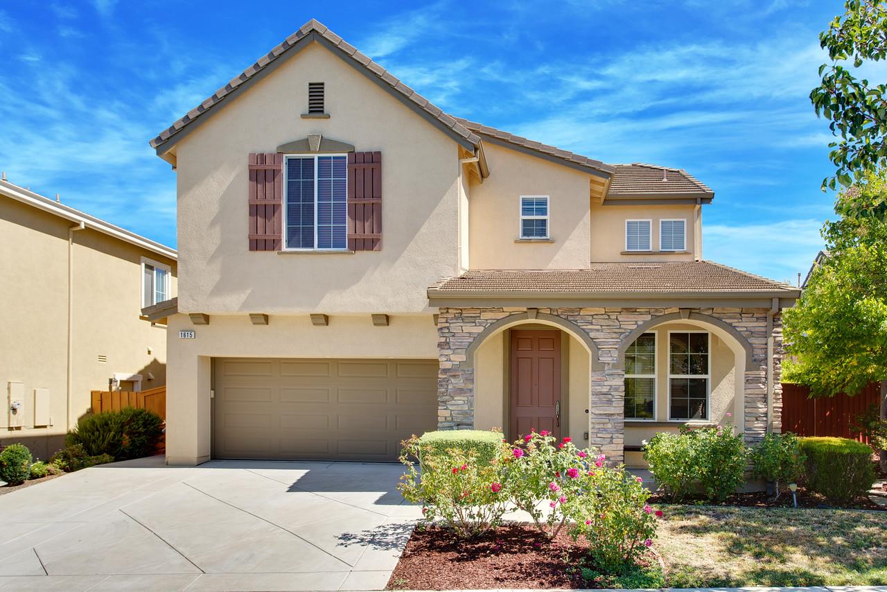 1615 Farringdon Way San Ramon, CA 94582 - Photo 1 of 18 a front view of a house with a garden