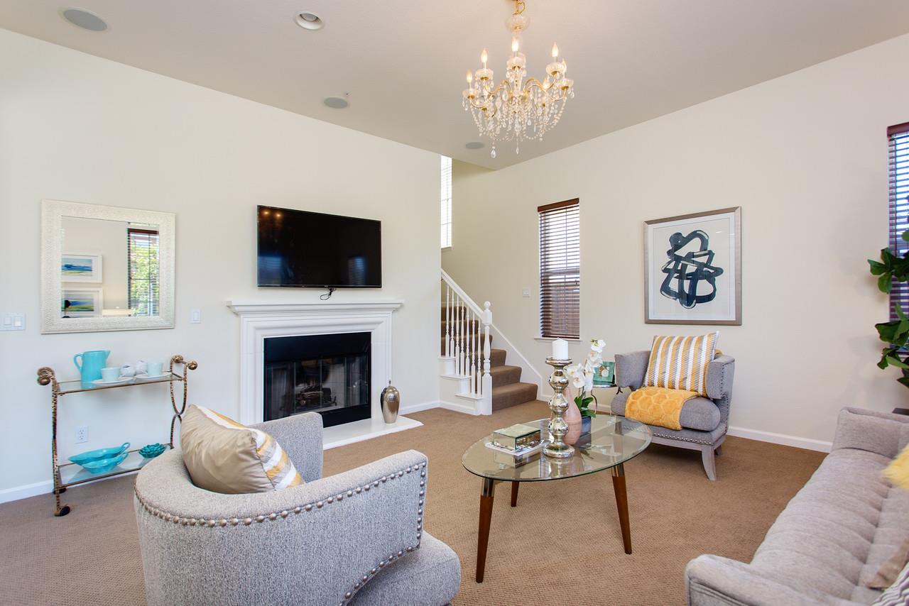 1615 Farringdon Way San Ramon, CA 94582 - Photo 9 of 18 a living room with furniture a fireplace and a flat screen tv