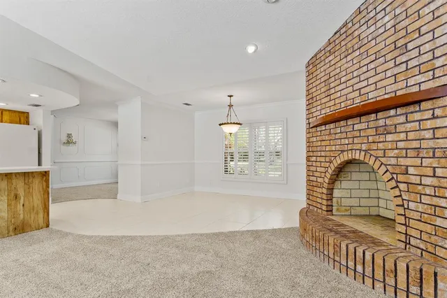 a view of a room with shelves and chandelier