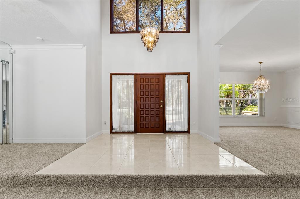 10206 Lakeview Drive New Port Richey, FL 34654 - Photo 4 of 53 an entryway with a bench in it