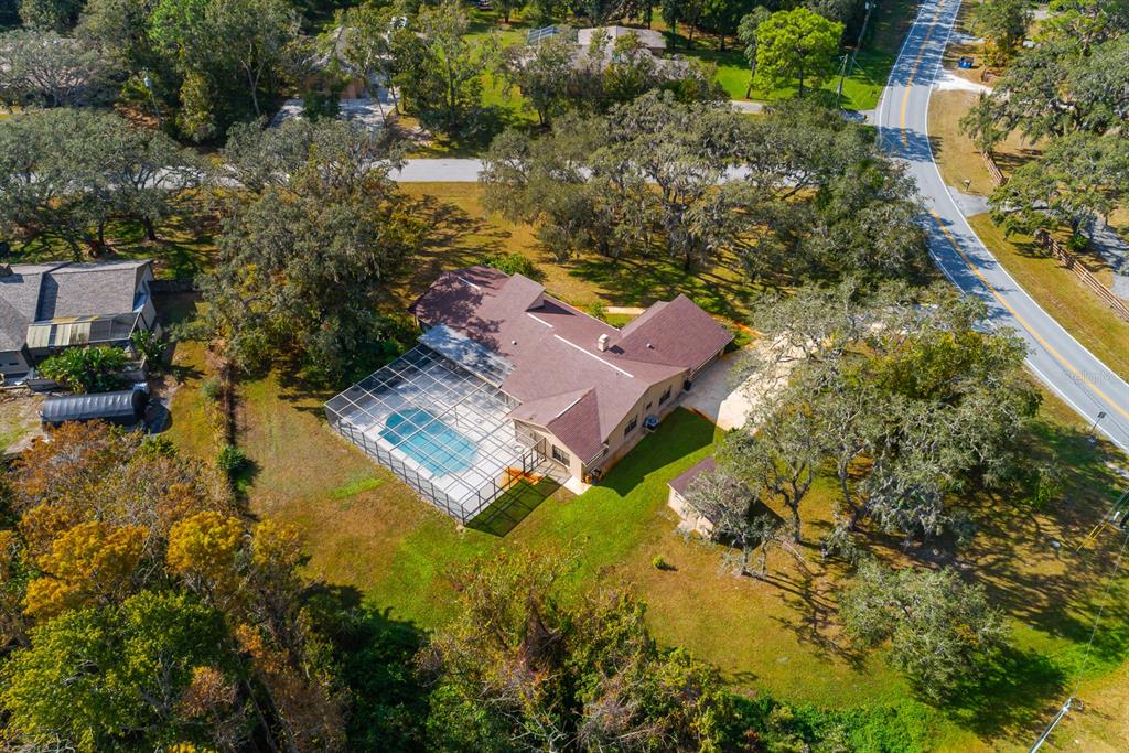 10206 Lakeview Drive New Port Richey, FL 34654 - Photo 53 of 53 an aerial view of house with yard swimming pool and outdoor seating
