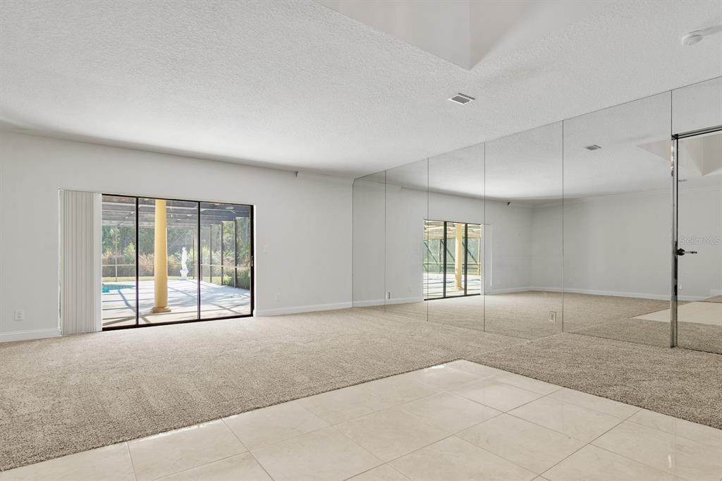 10206 Lakeview Drive New Port Richey, FL 34654 - Photo 7 of 53 a view of an empty room with a window