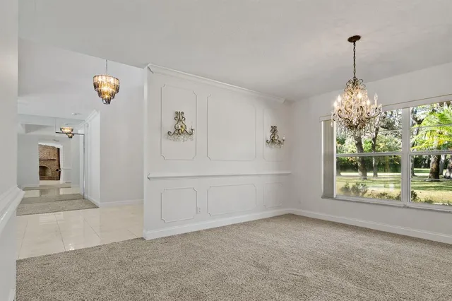a view of a room with window and cabinet