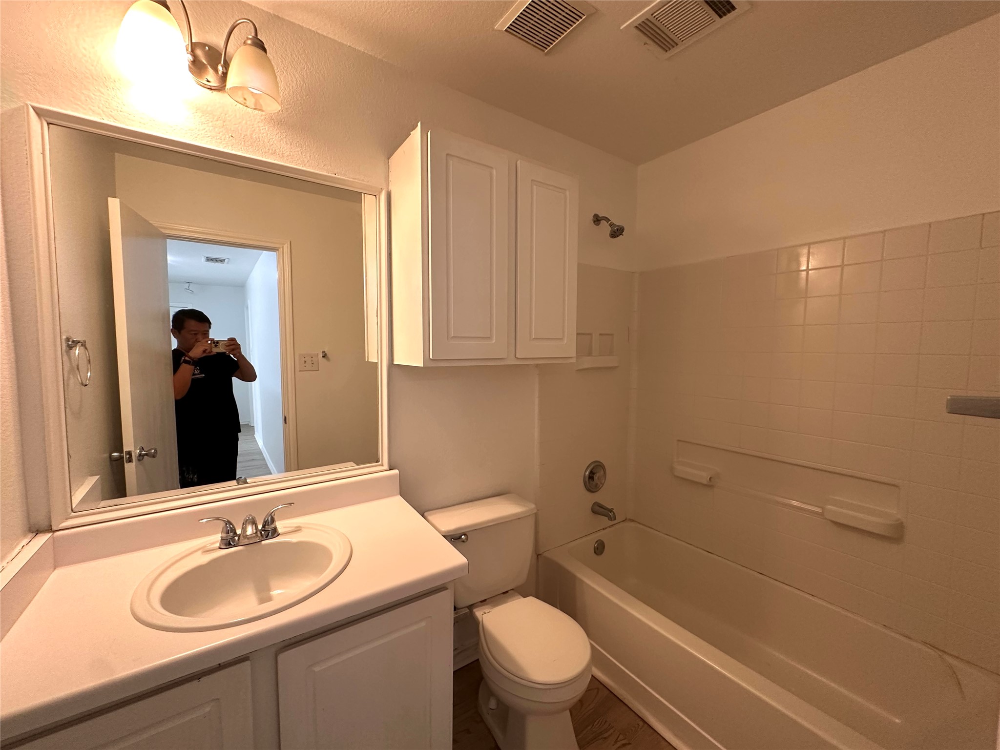 722 Lavaca Loop Elgin, TX 78621 - Photo 18 of 24 Bathroom with vanity and shower combination