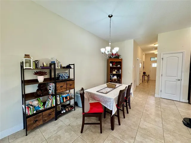 a living room with furniture a rug and a window