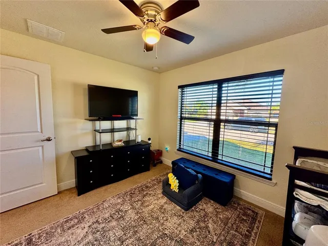 a bathroom with a granite countertop sink a mirror and a