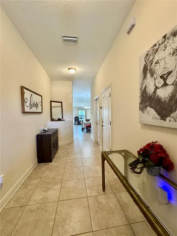 a kitchen with granite countertop kitchen island stainless steel appliances a sink a stove a refrigerator a sink and cabinets