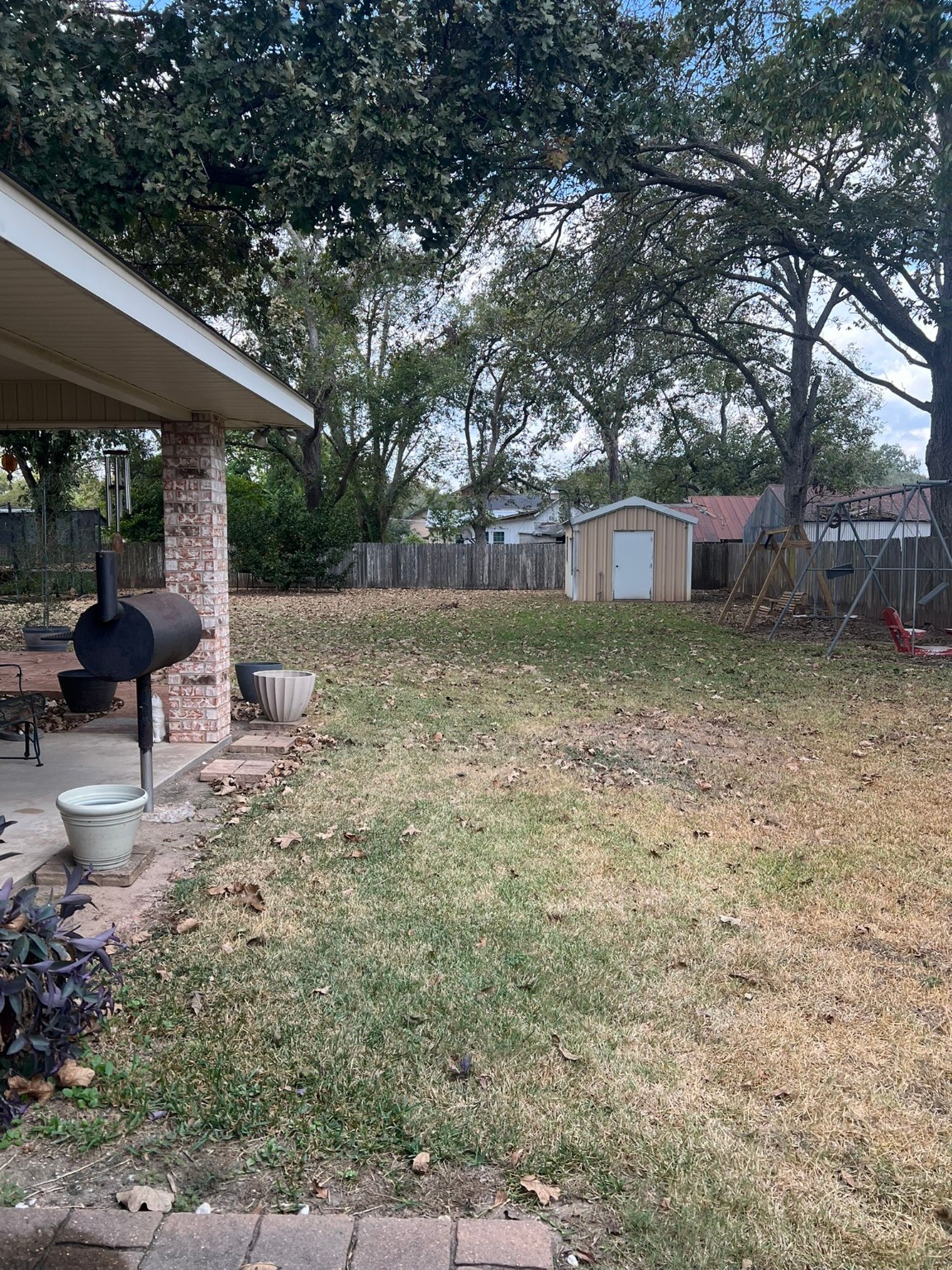 507 North Rusk Street Wharton, TX 77488 - Photo 14 of 18 a backyard of a house with lots of green space