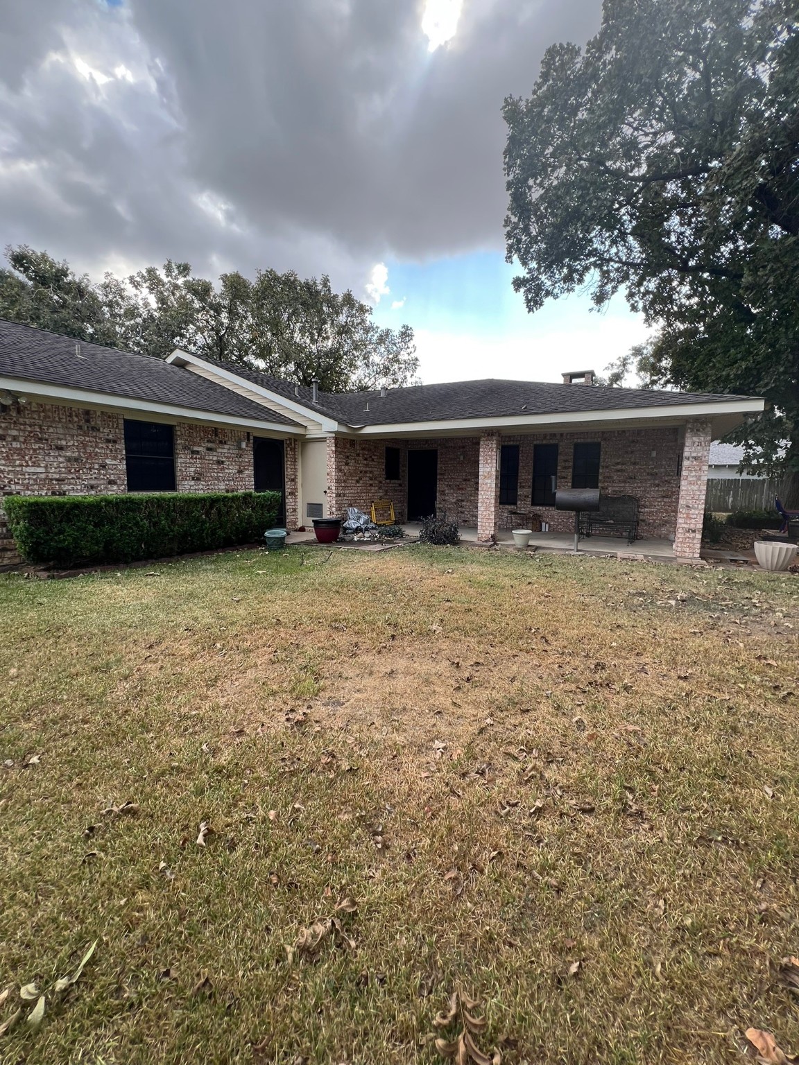 507 North Rusk Street Wharton, TX 77488 - Photo 15 of 18 a front view of house with yard and trees in the background