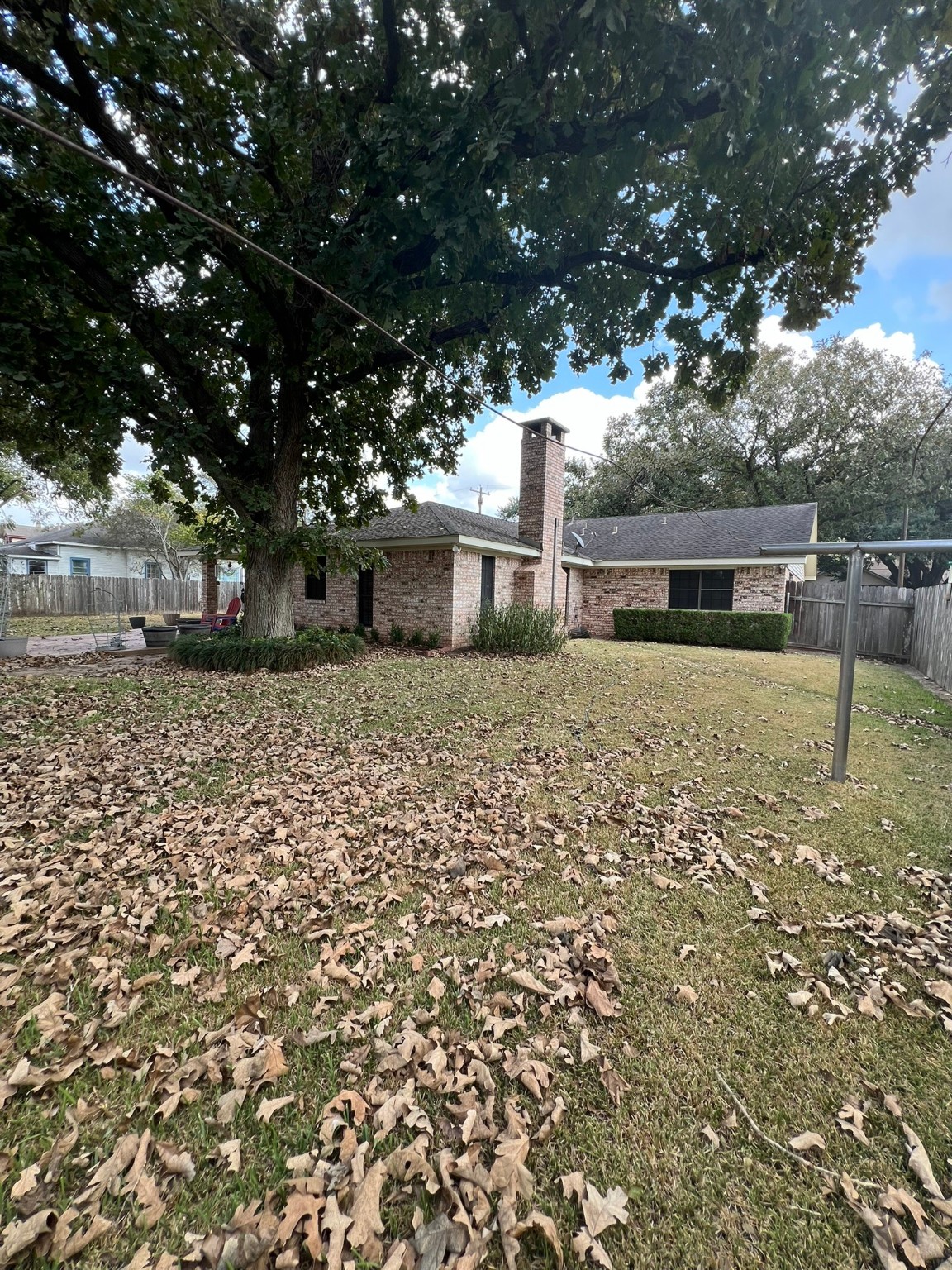 507 North Rusk Street Wharton, TX 77488 - Photo 18 of 18 a view of a backyard of the house
