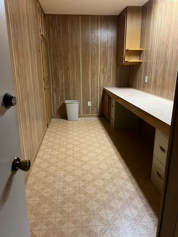 a bedroom with a bed and a cabinets