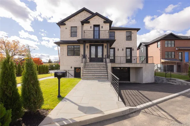 a view of entryway with wooden floor and a front door