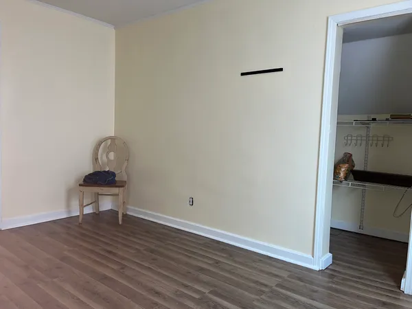 a white toilet sitting next to a bath tub