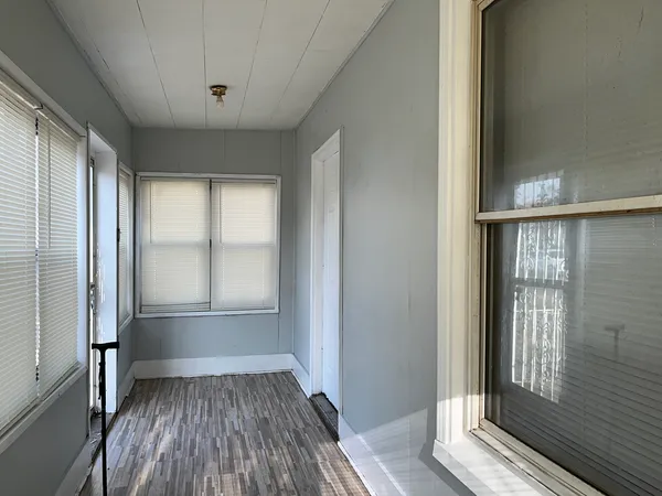 a view of an entryway with wooden floor and stairs