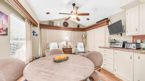 a kitchen with granite countertop a stove sink and refrigerator