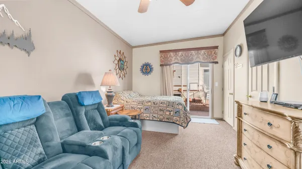 a view of a porch with furniture and a yard