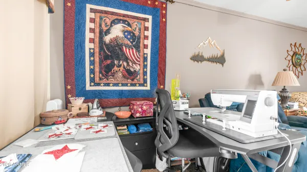 a view of a patio with table and chairs