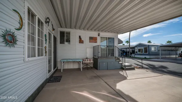 a front view of a building with outdoor seating