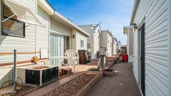 a view of a backyard with a patio