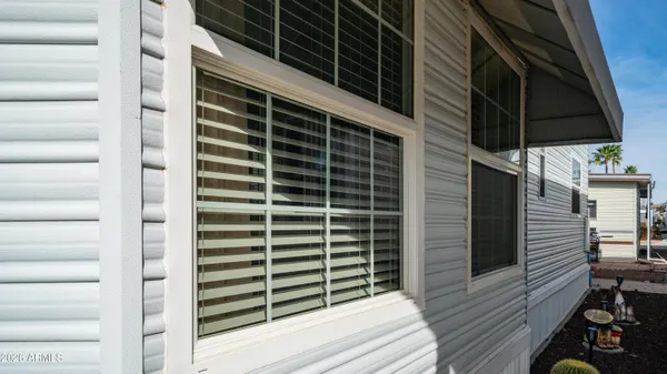 a view of a storage room with racks a chair