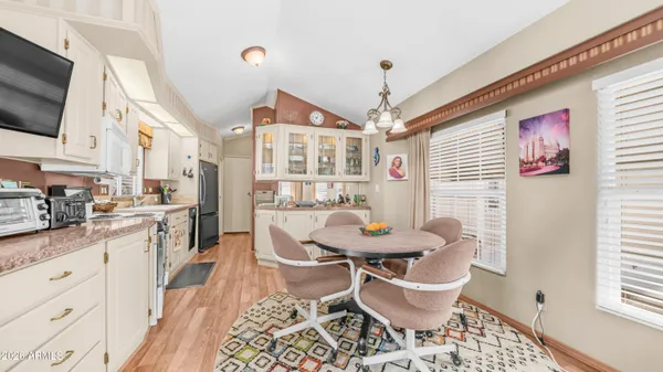 a kitchen with stainless steel appliances kitchen island granite countertop a sink and cabinets