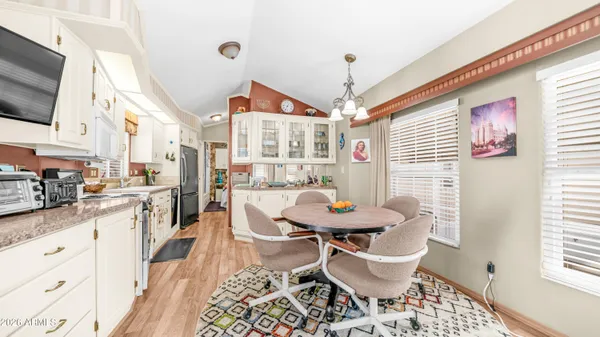 a living room with furniture a rug and a chandelier