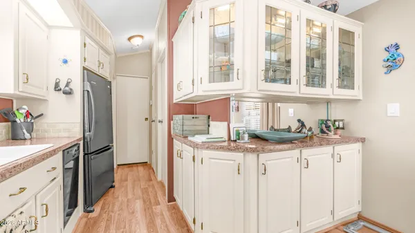 a bedroom with furniture and a large window