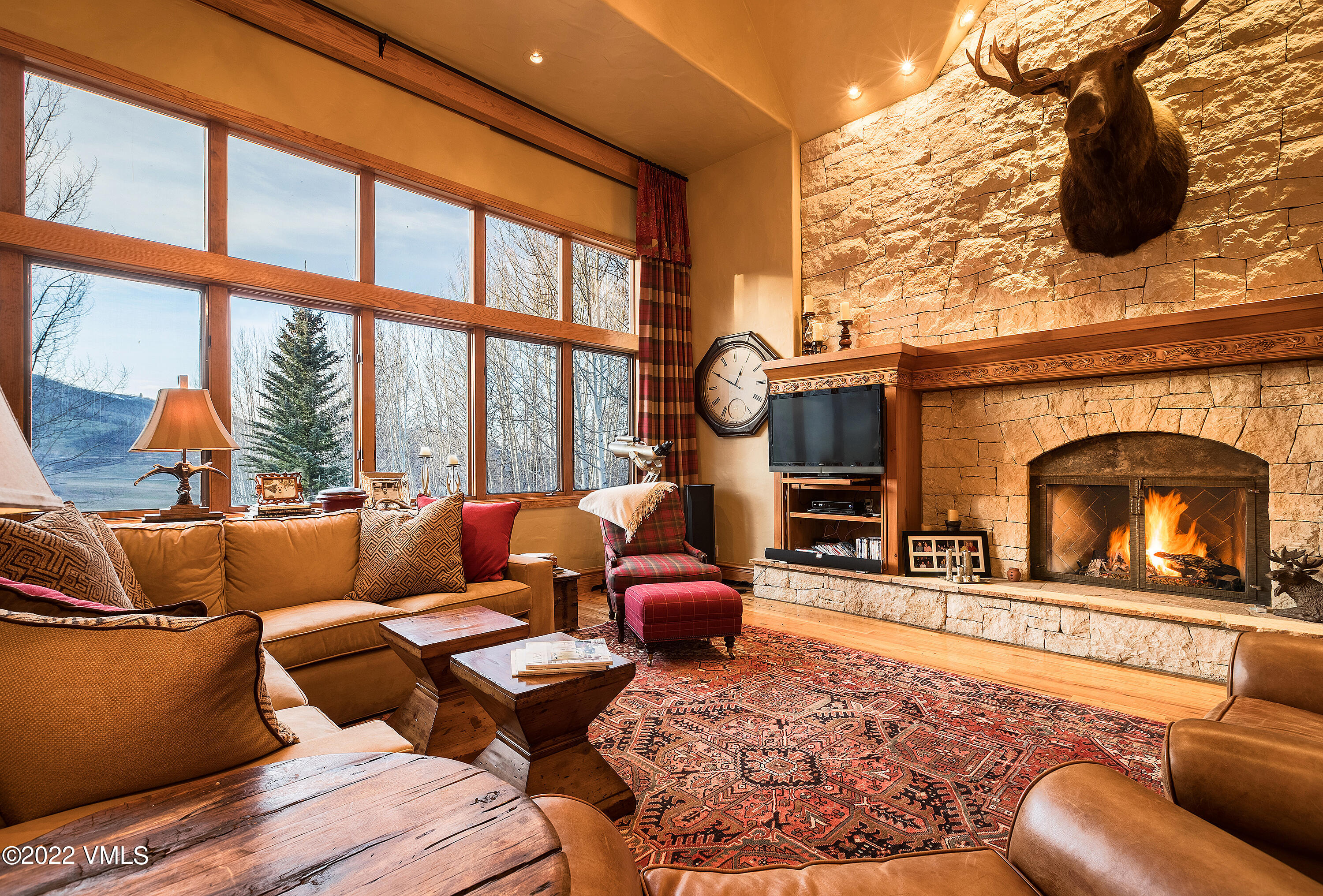 106 Pilgrim Drive Edwards, CO 81632 - Photo 2 of 21 a living room with furniture a fireplace and a floor to ceiling window
