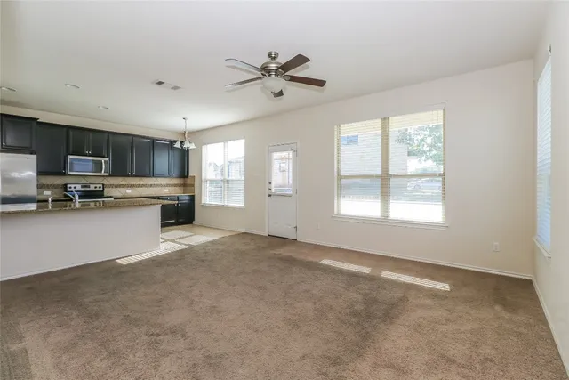 a view of a kitchen with a sink cabinets and a window