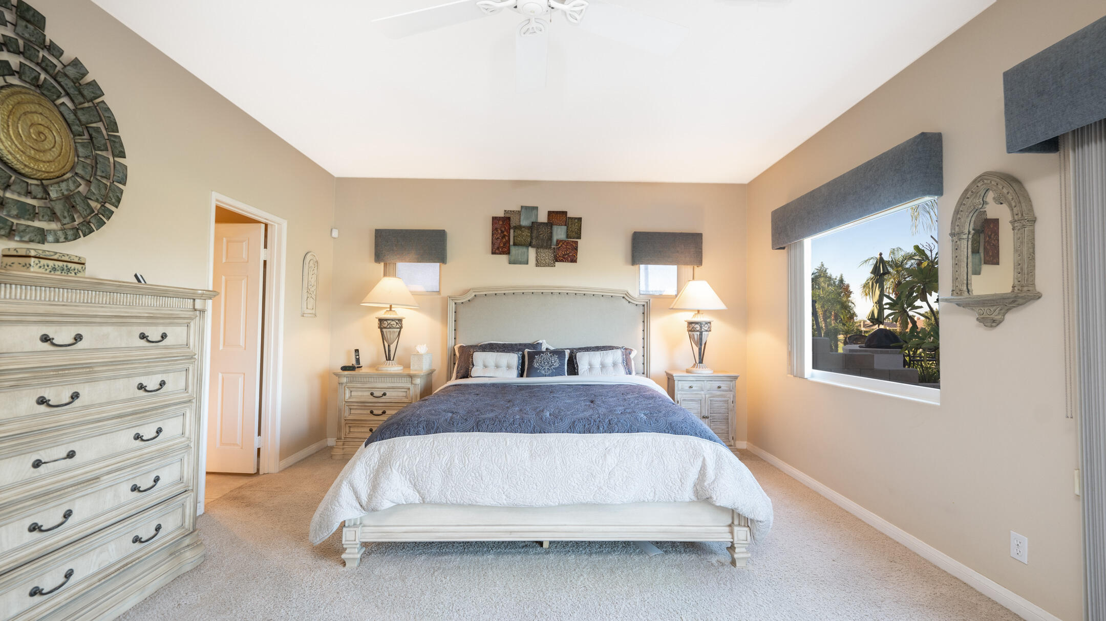 80290 Pebble Beach Drive Indio, CA 92201 - Photo 15 of 44 a bedroom with a bed and dresser