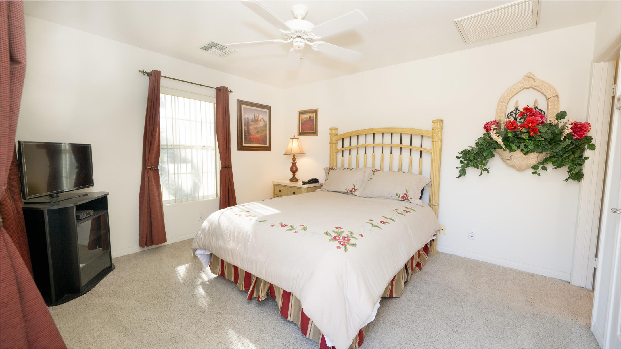 80290 Pebble Beach Drive Indio, CA 92201 - Photo 24 of 44 a bedroom with a bed and a flat screen tv