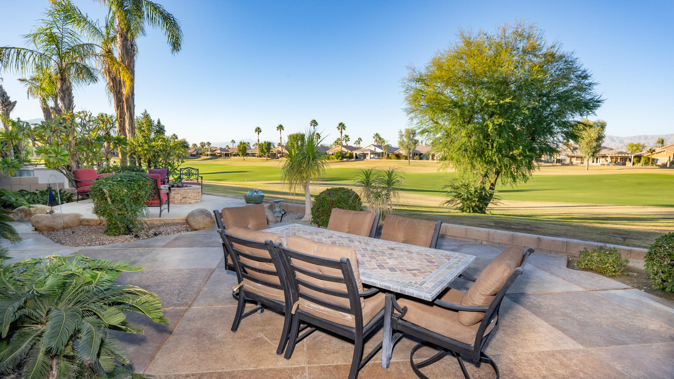 80290 Pebble Beach Drive Indio, CA 92201 - Photo 29 of 44 a view of a swimming pool with an outdoor seating space