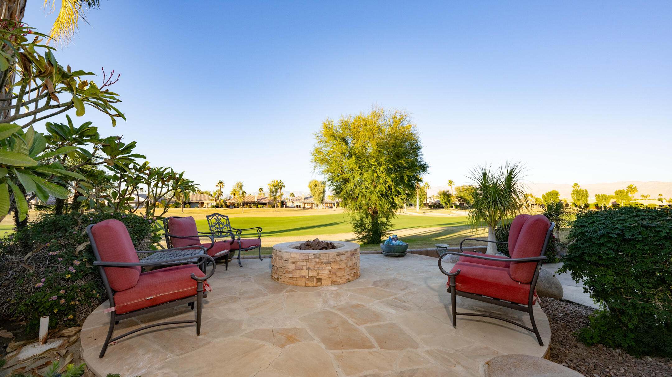 80290 Pebble Beach Drive Indio, CA 92201 - Photo 31 of 44 a swimming pool with outdoor seating and yard